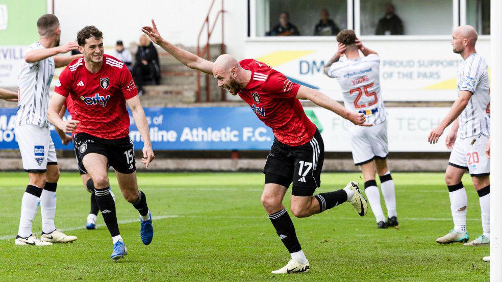 Zak Rudden celebrates his opener for Queen's Park against Dunfermline