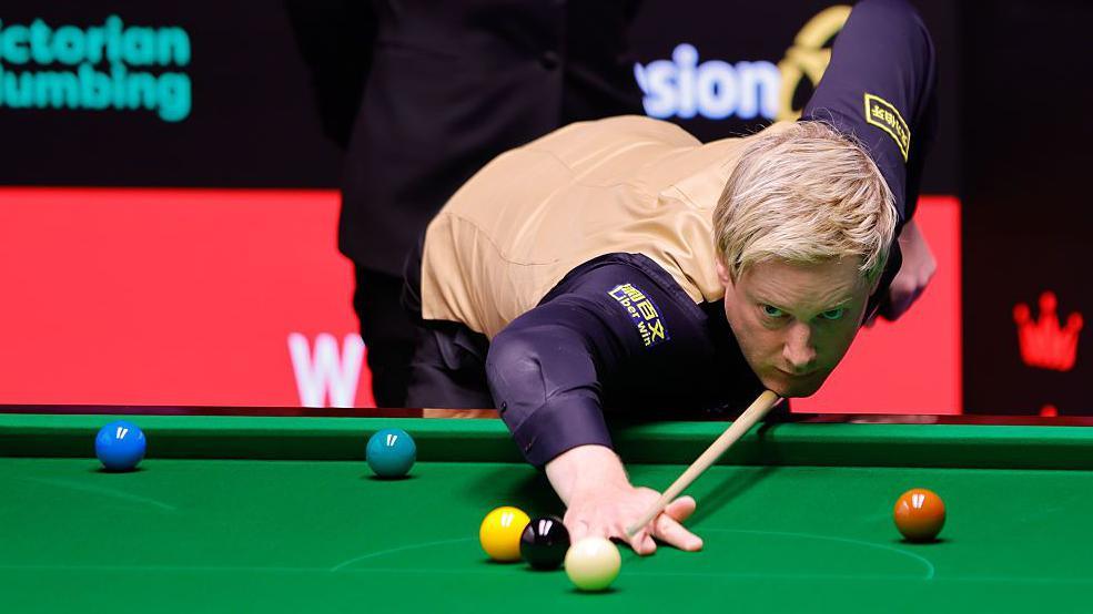 Neil Robertson plays a shot