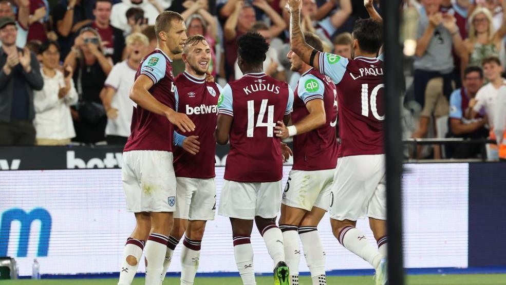 West Ham players celebrate scoring a goal