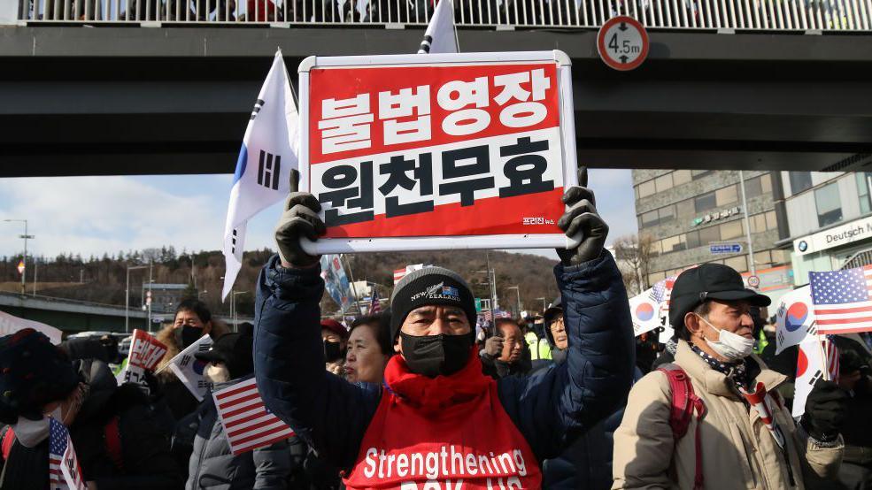 Pro-Yoon Suk Yeol supporters gather near the official residence of impeached South Korean President Yoon Suk Yeol on January 03, 2025 in Seoul, South Korea. 