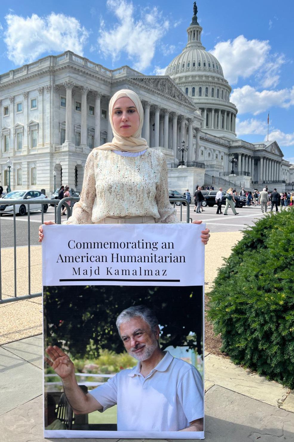 Maryam Kamalmaz with a photo of her father 