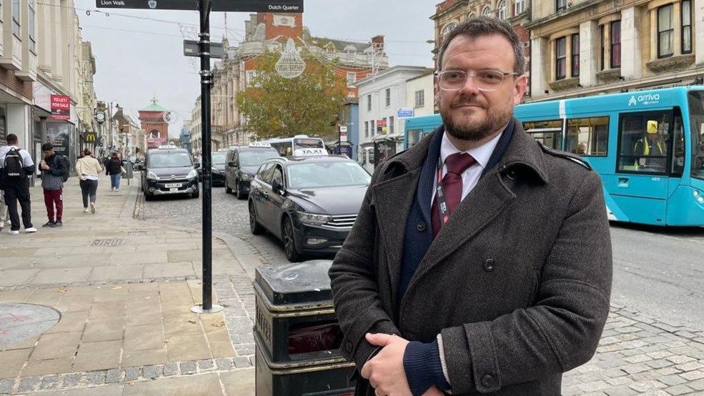 Sgt Christian Denning standing in Colchester High Street