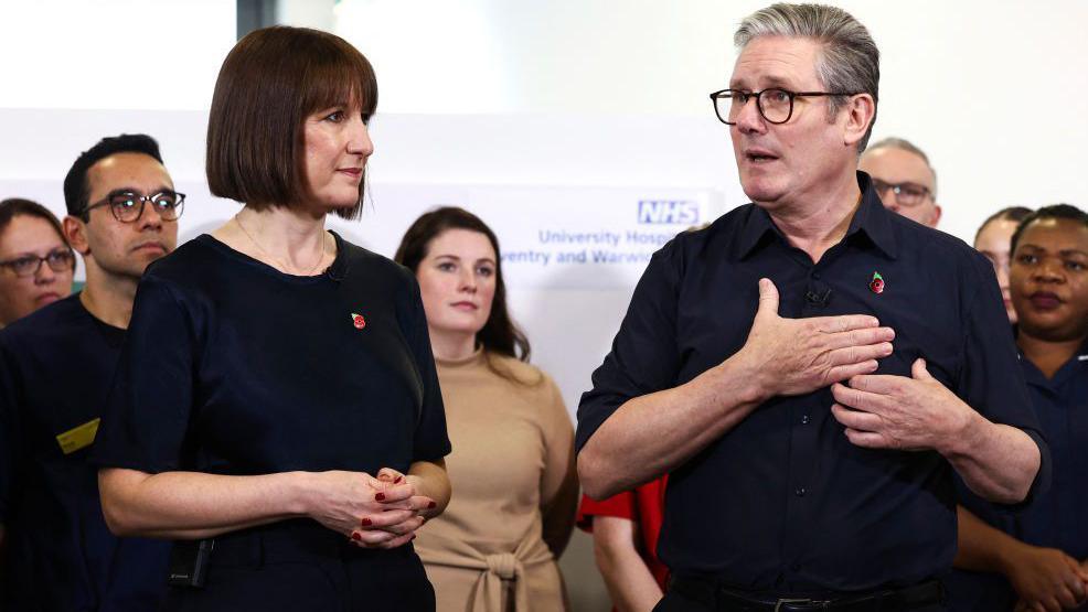 Chancellor Rachel Reeves and Prime Minister Keir Starmer deliver a speech in a hospital