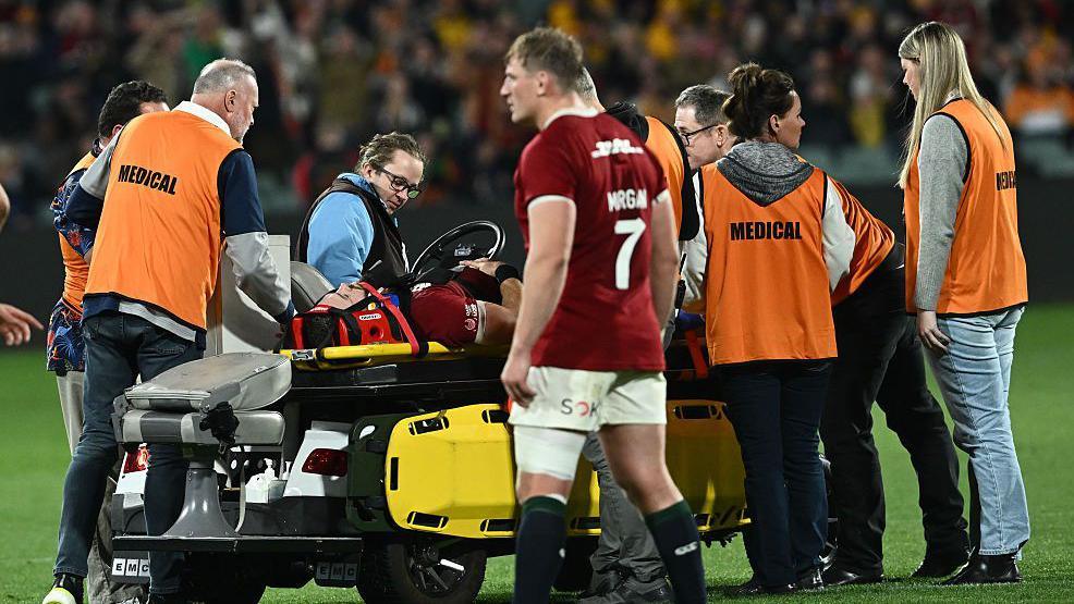 Luke Cowan-Dickie departs the pitch on a stretcher