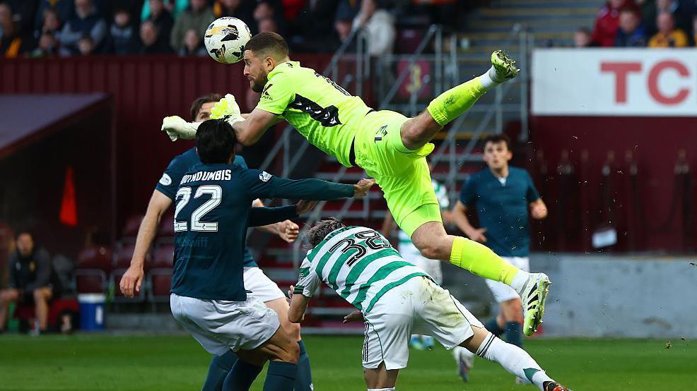 Motherwell goalkeeper Calum Ward clatters into Daizen Maeda in one of the early flashpoints across both games. No penalty given, though.