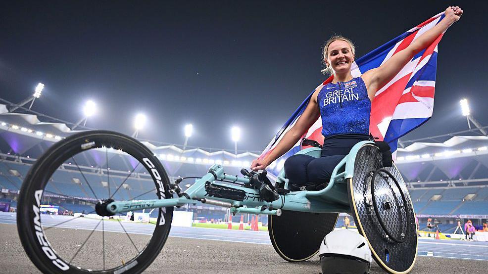Melanie Woods celebrating with the Union Jack.