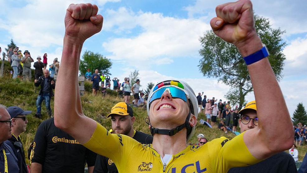 Tadej Pogacar celebrates winning stage 14 of the Tour de France