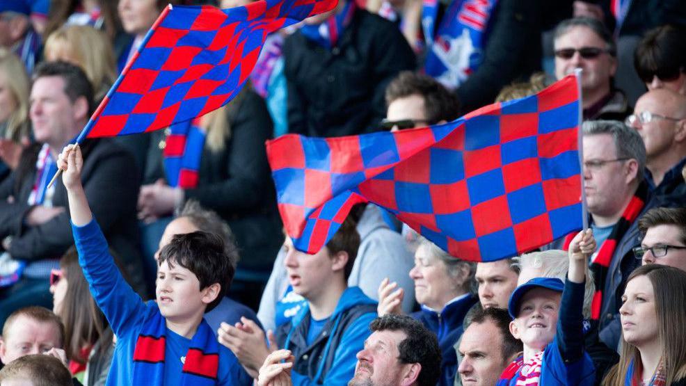 Inverness Caledonian Thistle fans waving flags at the 2015 Scottish Cup final