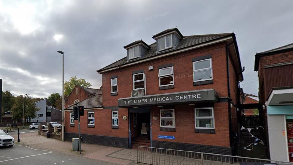 A redbrick building with a sign saying "The Limes Medical Centre" across the front.