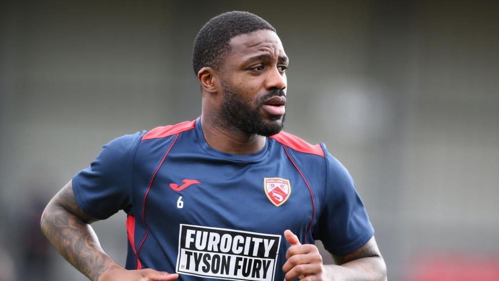 Yann Songo'o on the pitch for Morecambe in 2023-24