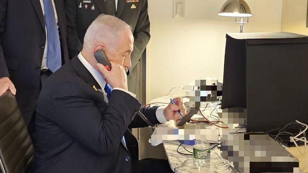 Photo that reportedly shows Benjamin Netanyahu approving an airstrike on Beirut targeting Hezbollah's main headquarters, apparently from his hotel room (in New York