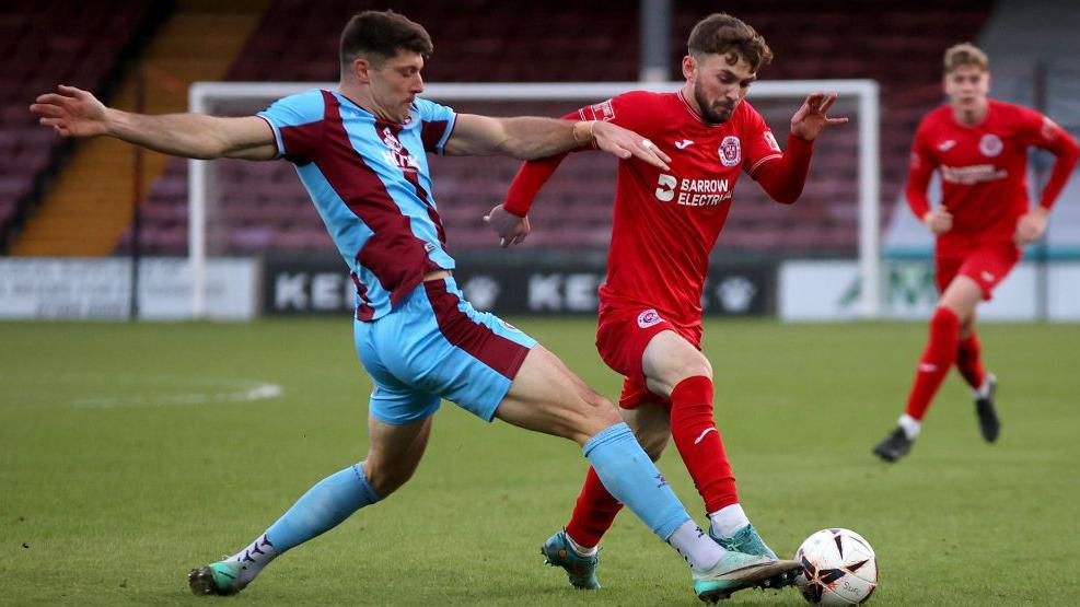 Will Evans of Scunthorpe United makes a tackle