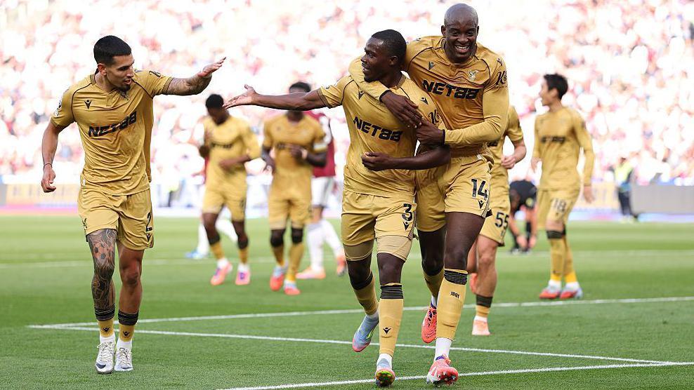 Tyrick Mitchell celebrates