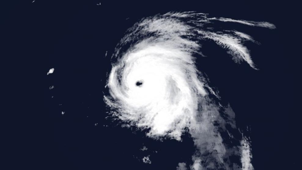 Satellite image of rotating white cloud with a well-defined clear eye in the centre