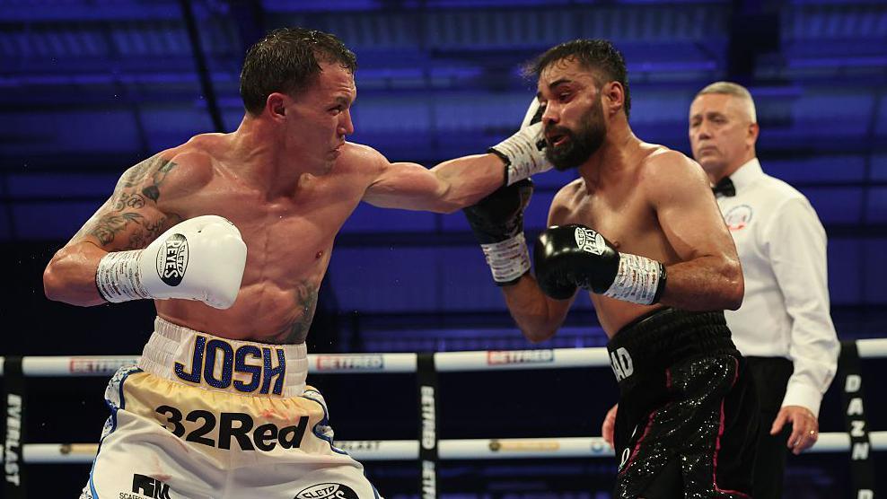 Josh Warrington lands a left punch on Asad Asif Khan