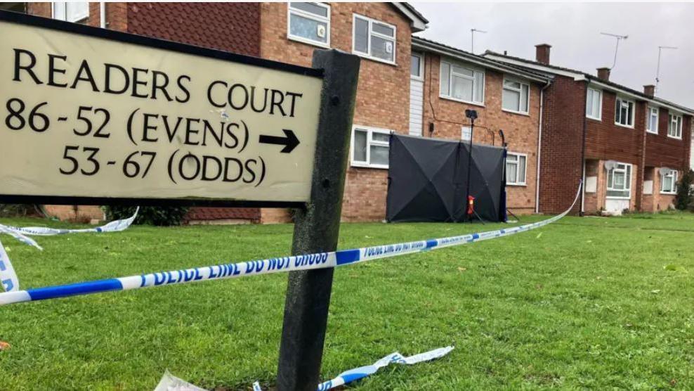 Road sign of Readers Court with a police cordon.