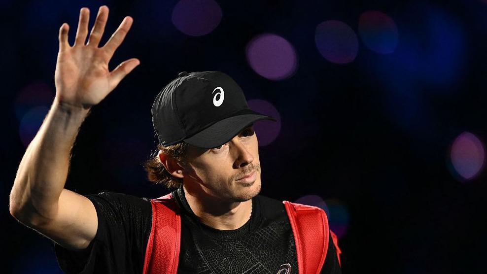 Alex de Minaur waves to the crowd as he is beaten at the ATP Finals