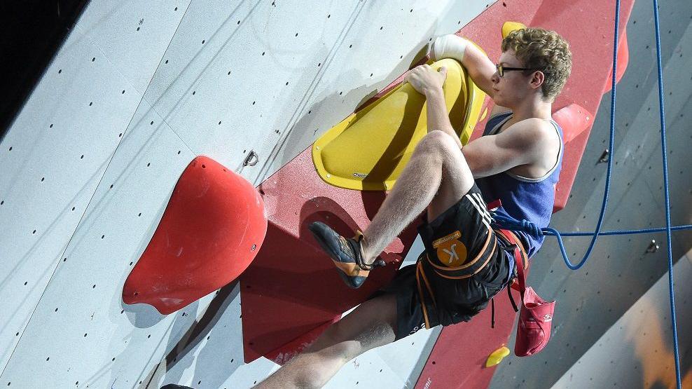 man on climbing wall. 