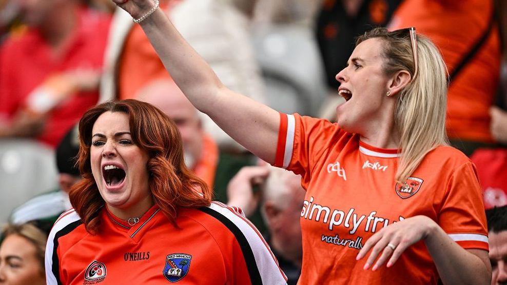 Two women supporting Armagh GAA during match