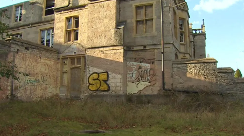 Graffiti on the side of the derelict former asylum