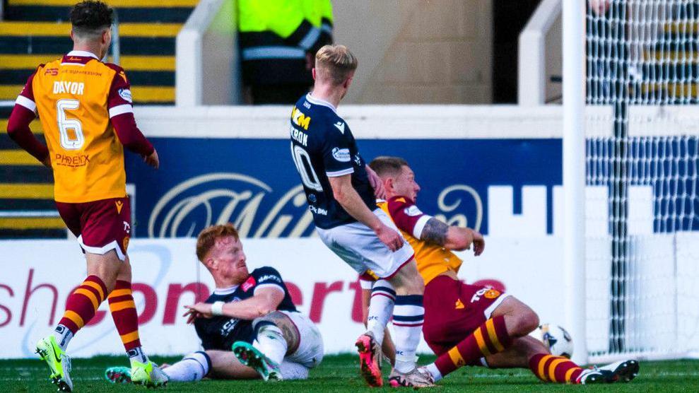 Dundee's Lyall Cameron scores against Motherwell