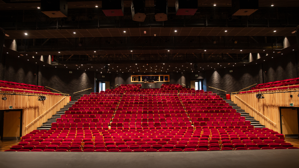 Stage view of the auditorium, of 800 red empty seats.