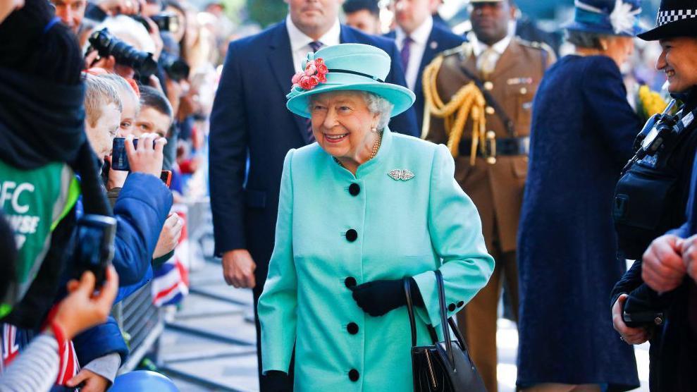 Britain's Queen Elizabeth II smiles as she greets well-wishers on arrival at The Lexicon shopping centre during a visit to Bracknell on 19 October 2018.