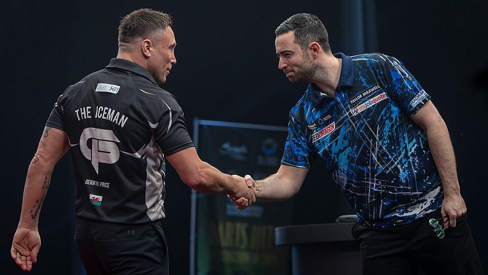 Gerwyn Price (left) shakes hands with Luke Humphries (right)