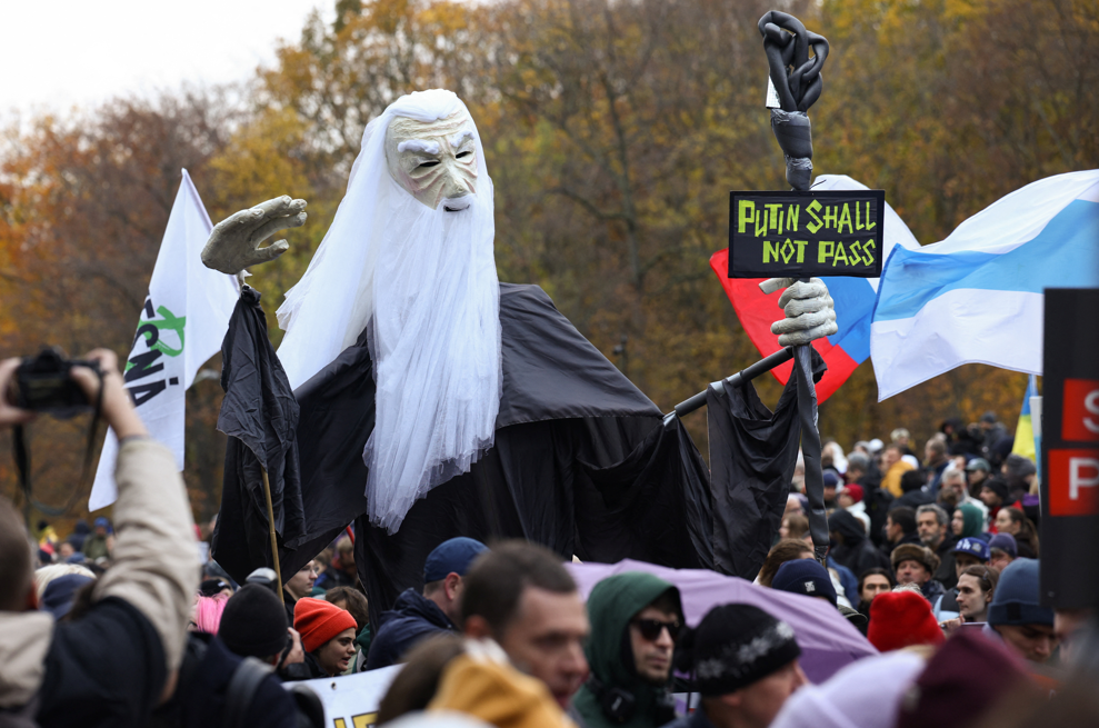 People attend an anti-Putin protest in Berlin.