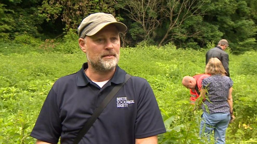 Neil Green standing among Himalayan Balsam 