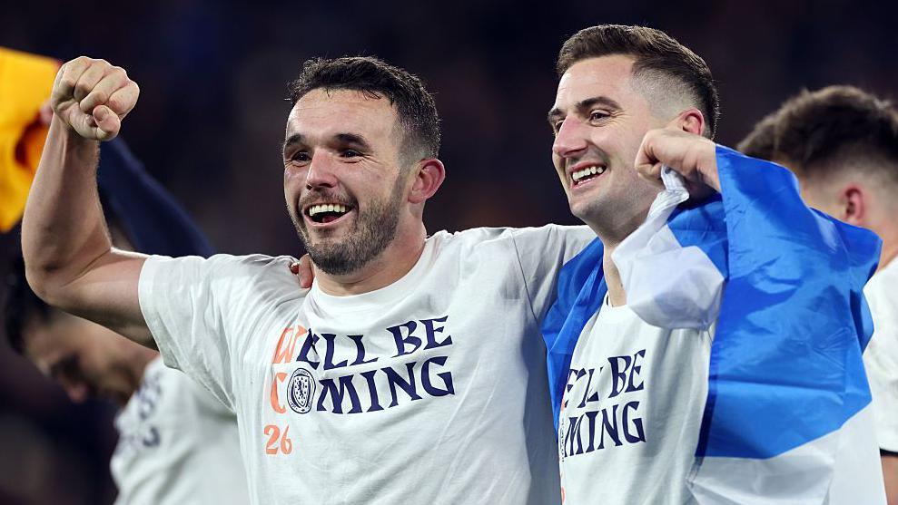 John McGinn and Kenny McLean of Scotland celebrate qualifying for the World Cup finals