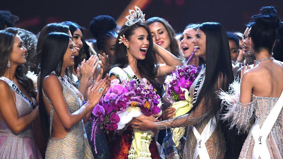 Beauty queens congratulating the newly-crowned Miss Universe