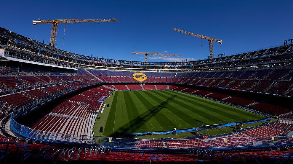The Nou Camp with cranes in the background