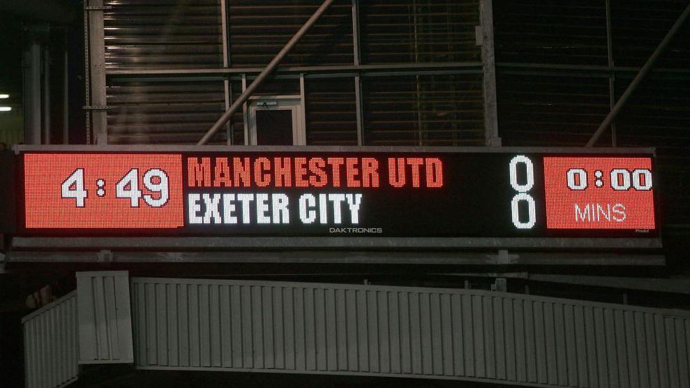 The scoreboard at Old Trafford in 2005 showing Manchester City 0-0 Exeter City