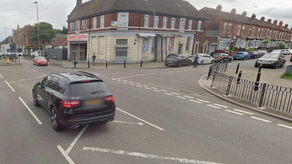 A car is turning into Clarence Road off Holyhead Road, a main road, in Handsworth. 