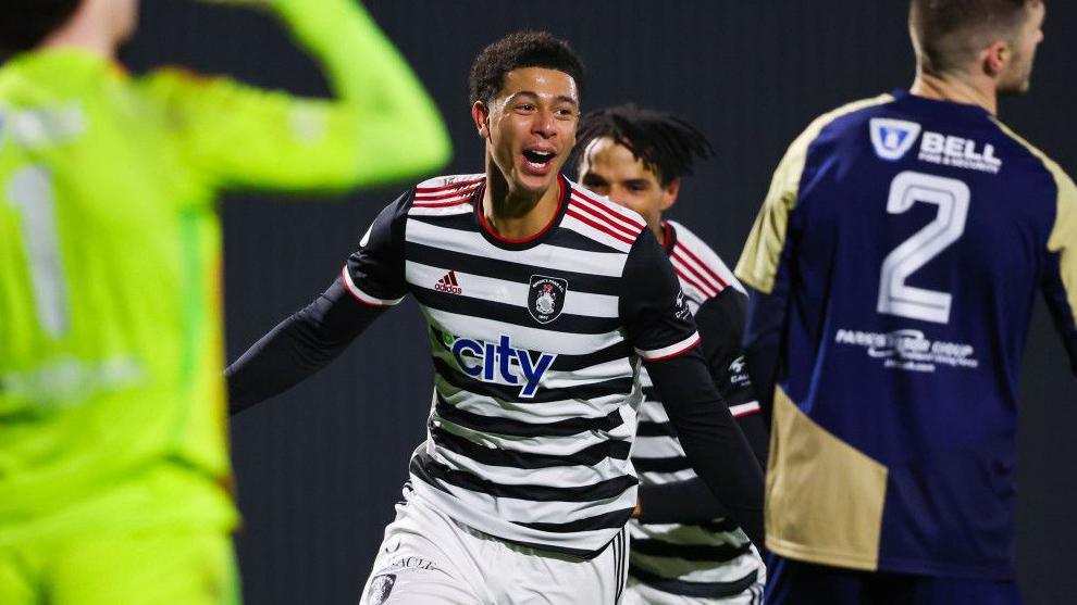 Queen's Park's Reece Evans celebrates