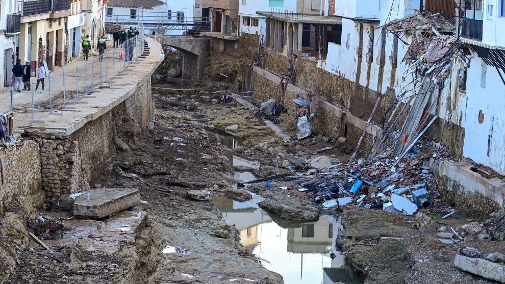 Debris lies in the river next to destroyed houses in Chiva, in the region of Valencia, eastern Spain, in the aftermath of catastrophic deadly floods on November 19, 2024