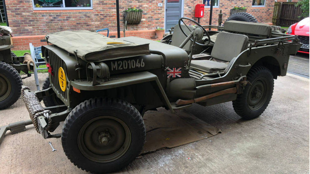 A jeep from Dday - green with no canopy and a union flag 