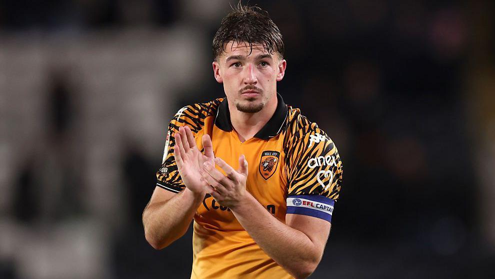 Hull captain Charlie Hughes claps