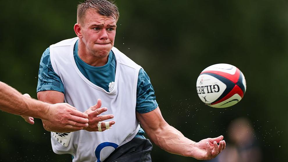 Joe Carpenter prepares to catch the ball during a training session