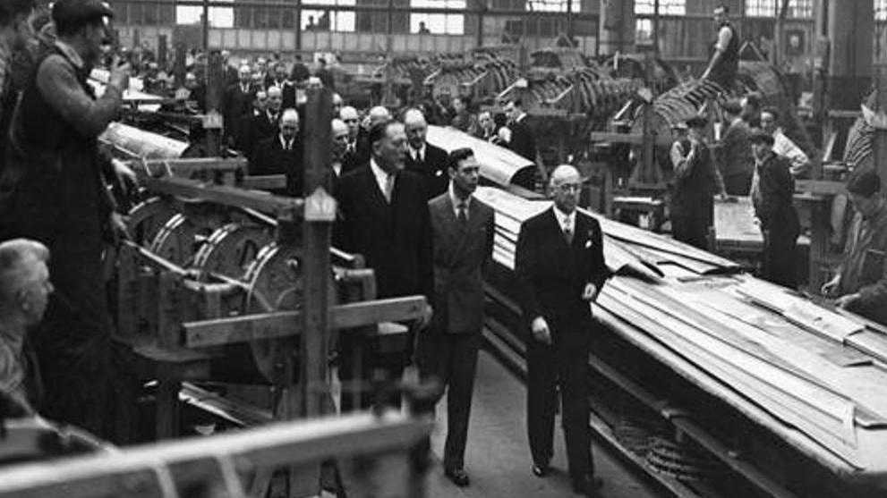 Photograph of King George VI visiting an aeroplane factory in Stockport in 1939. It was part of a royal tour of munitions factories in Lancashire.