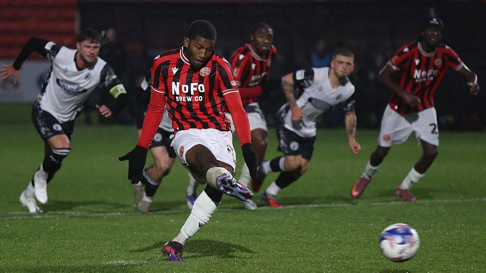 Daniel Kanu scores for Walsall from the penalty spot