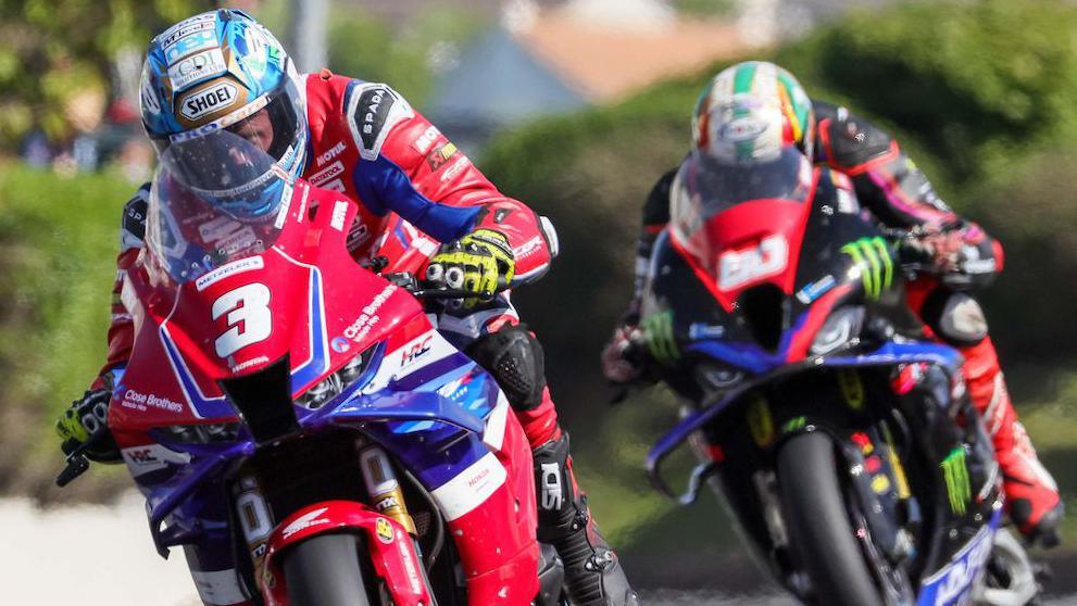 Dean Harrison leads Peter Hickman during a Superstock race at the 2025 North West 200