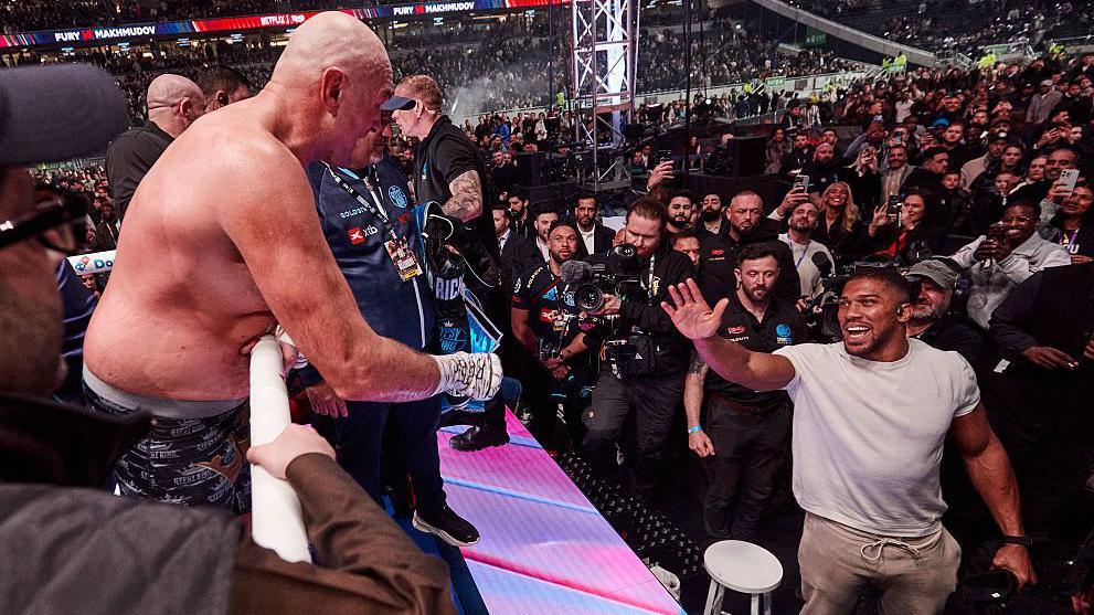 Tyson Fury shares words with Anthony Joshua after his latest win