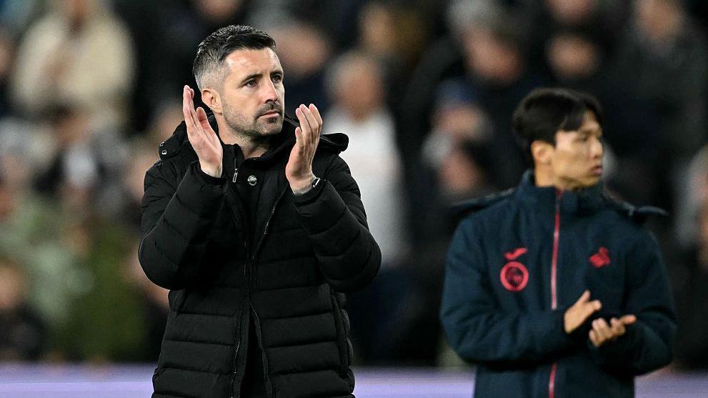 Alan Sheehan applauds fans in one of his final Swansea games