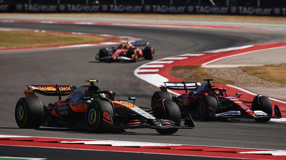 McLaren's Lando Norris challenging Ferrari's Charles Leclerc for second place during the United States Grand Prix