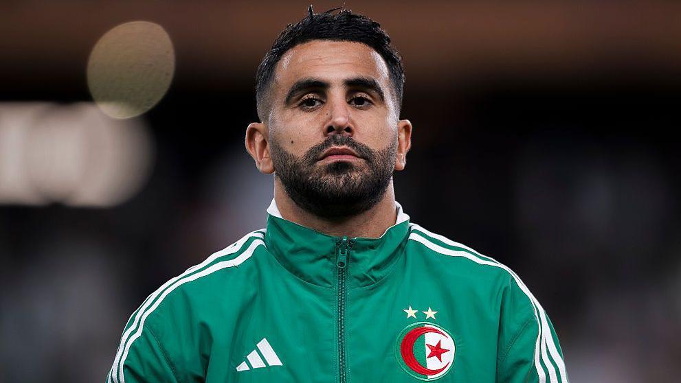 Riyad Mahrez in a green Algeria jacket