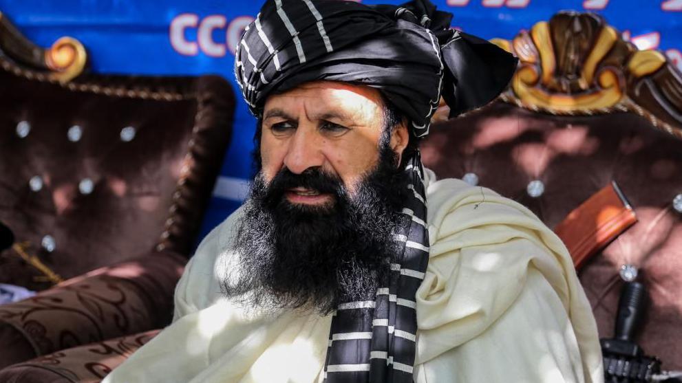 Khalilur Rahman Haqqani, Minister of Refugees and Repatriates Affairs, attends a ceremony in which officials of the Taliban Ministry of Immigrants and Returnees registered internally displaced persons in Kabul, Afghanistan, 12 November 2024.