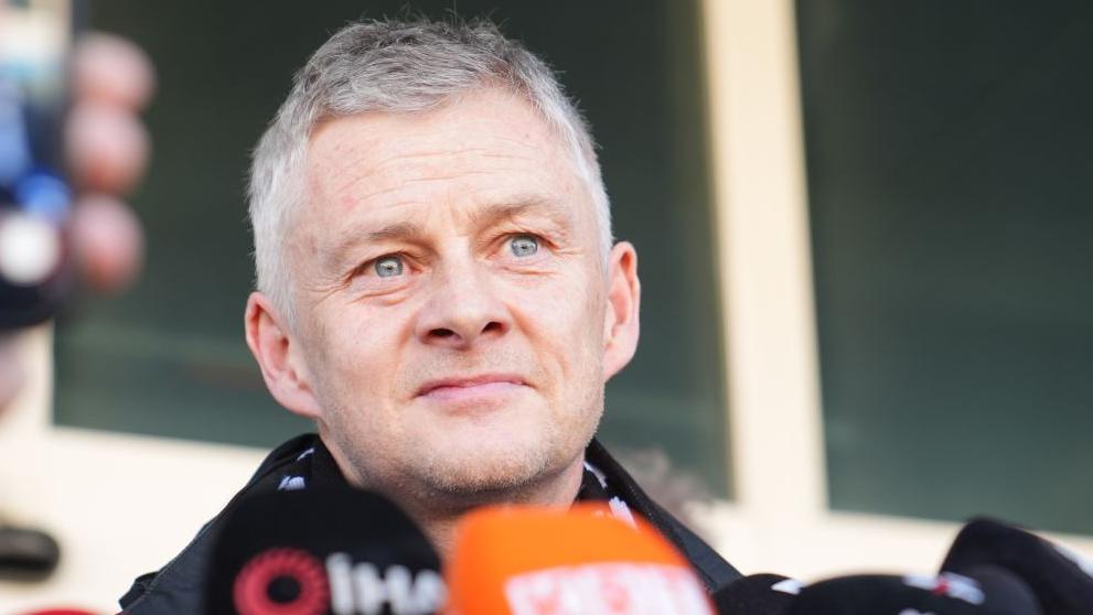 Ole Gunnar Solskjaer faces the media at Ataturk Airport, Istanbul on Friday