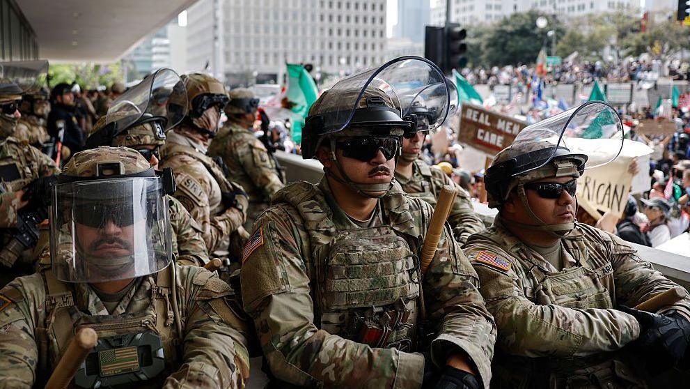 California National Guard soldiers stand guard at a federal building on 14 June 2025 in Los Angeles, California, during a "No Kings" protest against the Trump administration.